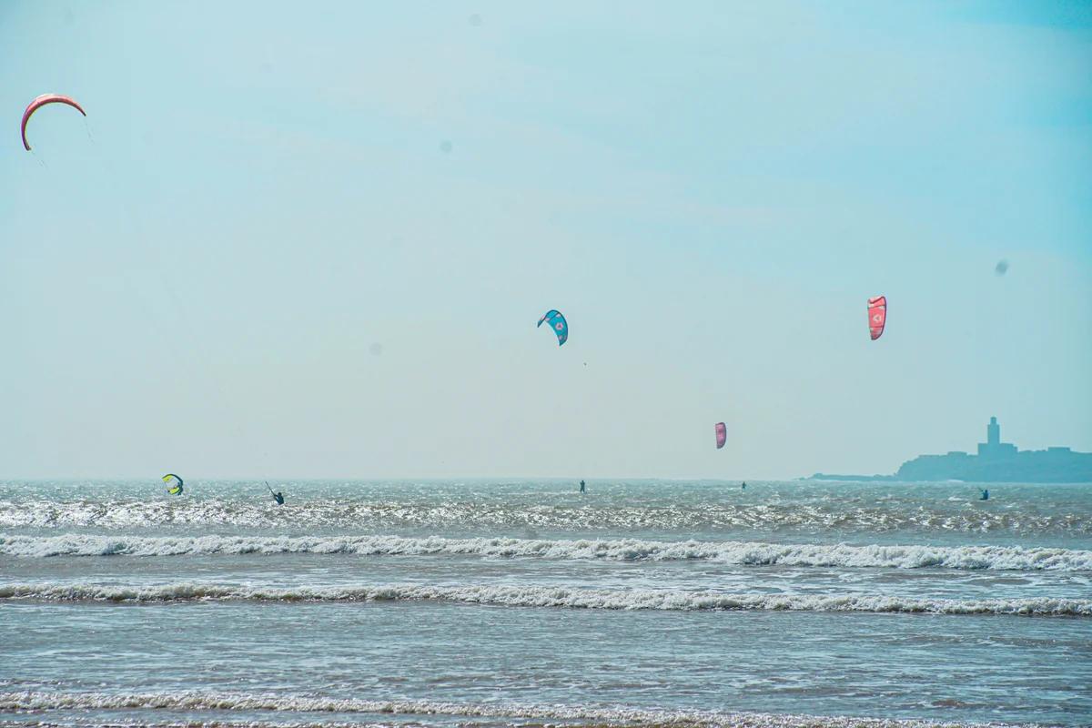 Kitesurfers riding on the ocean at Essaouira main beach with consistent trade wind conditions